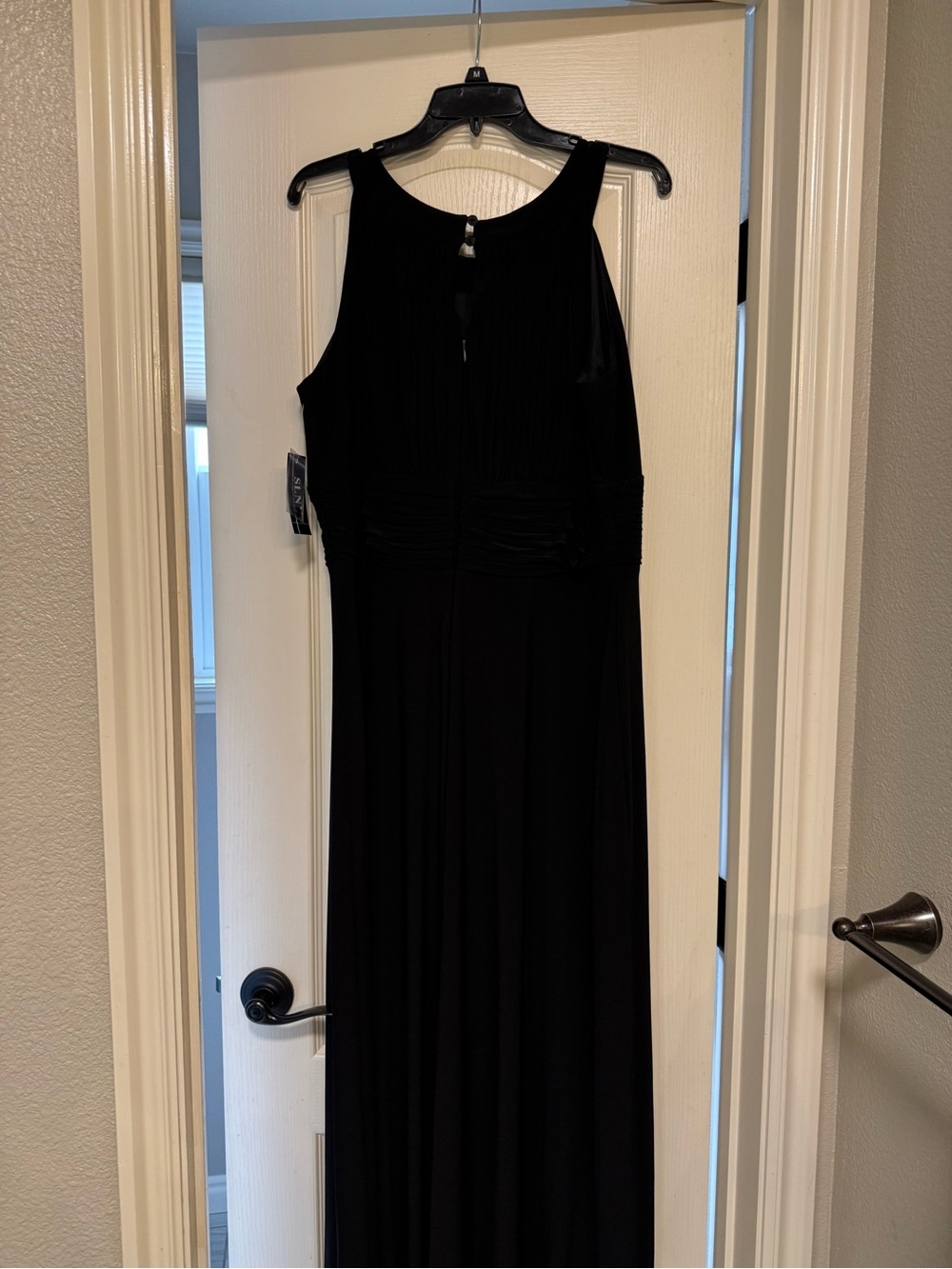Black formal dress perfect for a wedding, prom, or a black tie event.